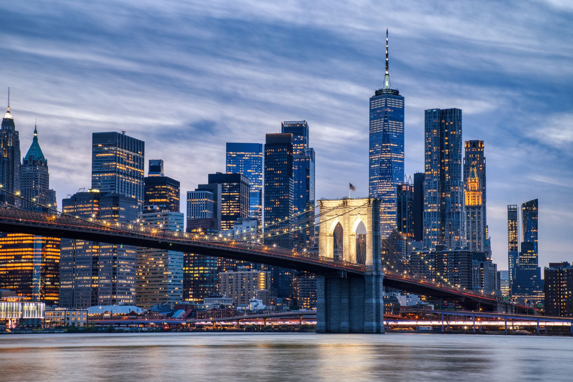 The Brooklyn Bridge and Lower Manhattan skyline at dusk
